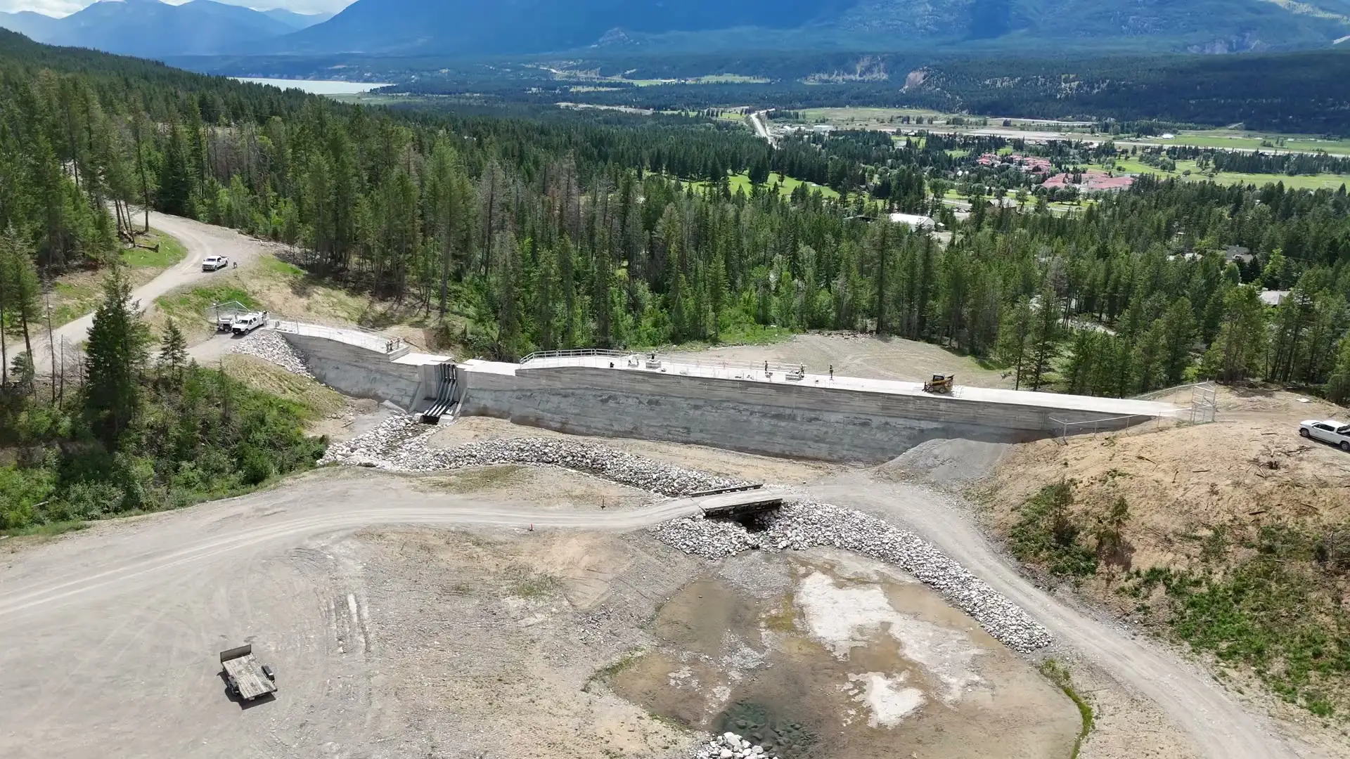 Aerial view of a completed debris-flow barrier above the valley
