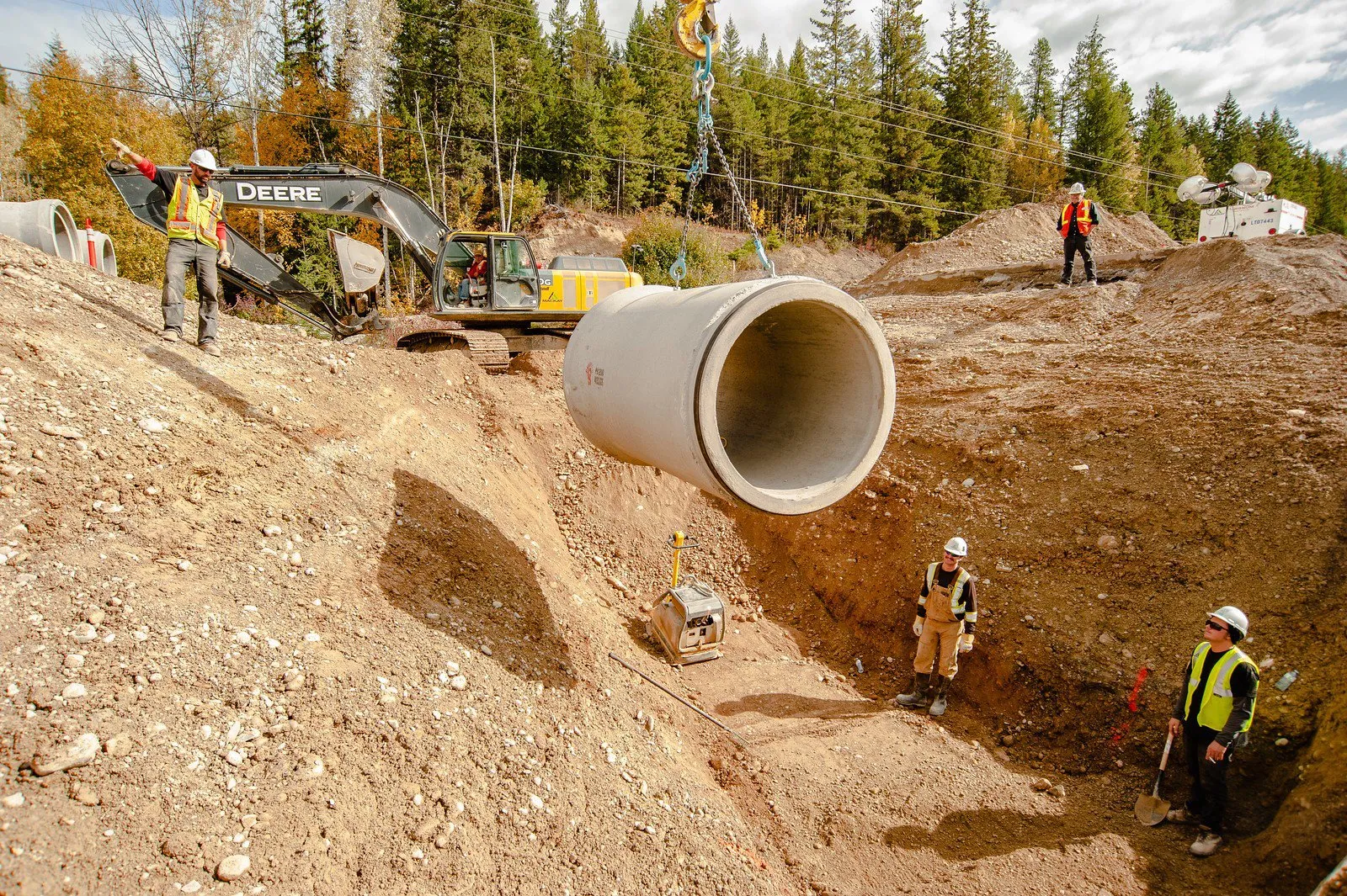 Crew installing a large culvert on the Trans-Canada four-laning project