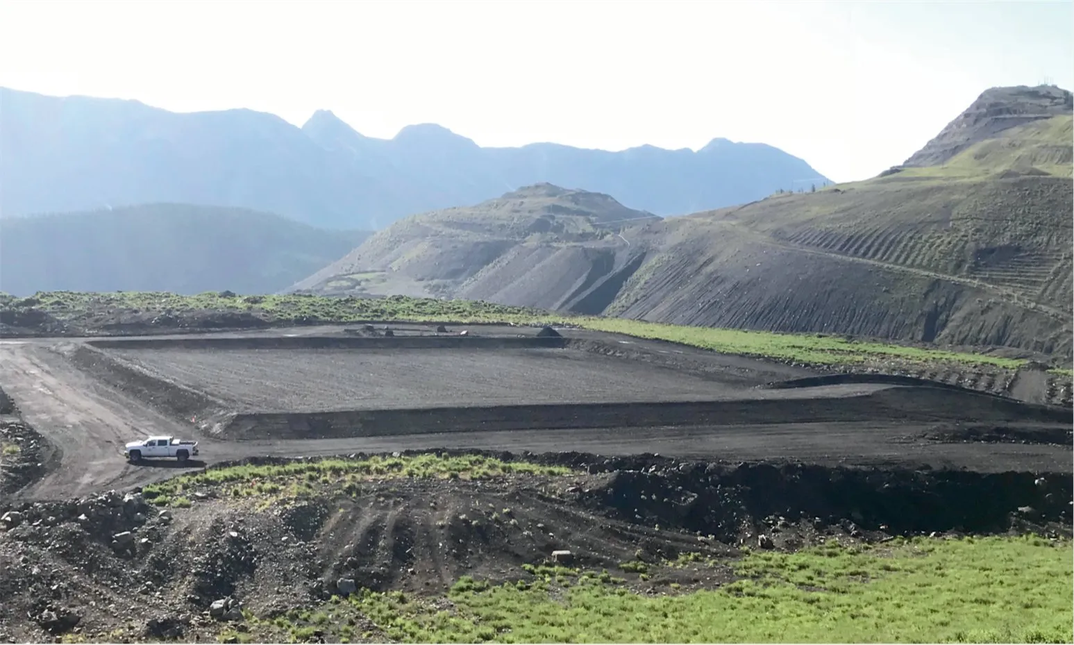Crews placing geomembrane liner at the soil treatment facility