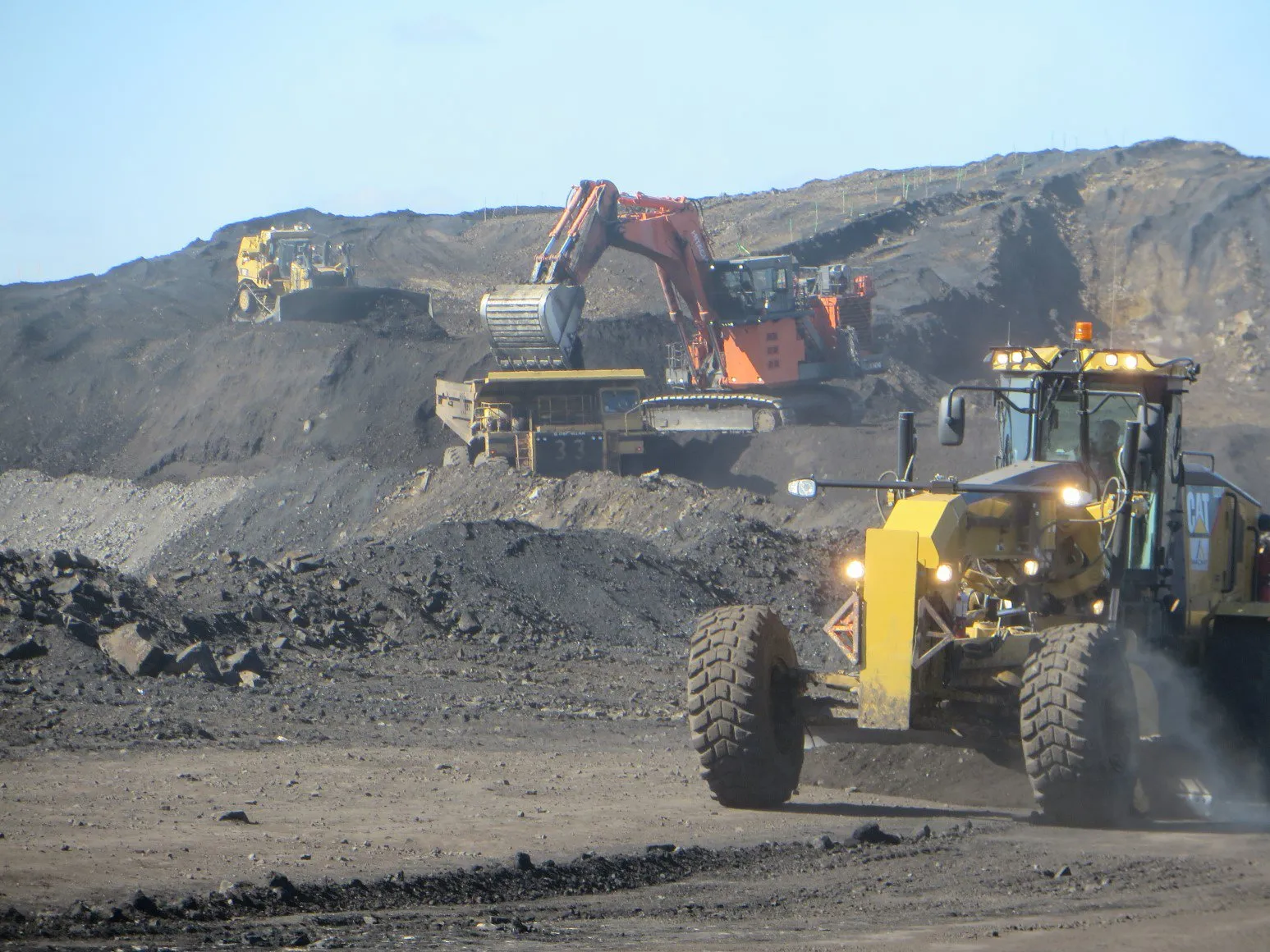 Excavator loading a haul truck on the Mount Michael benches