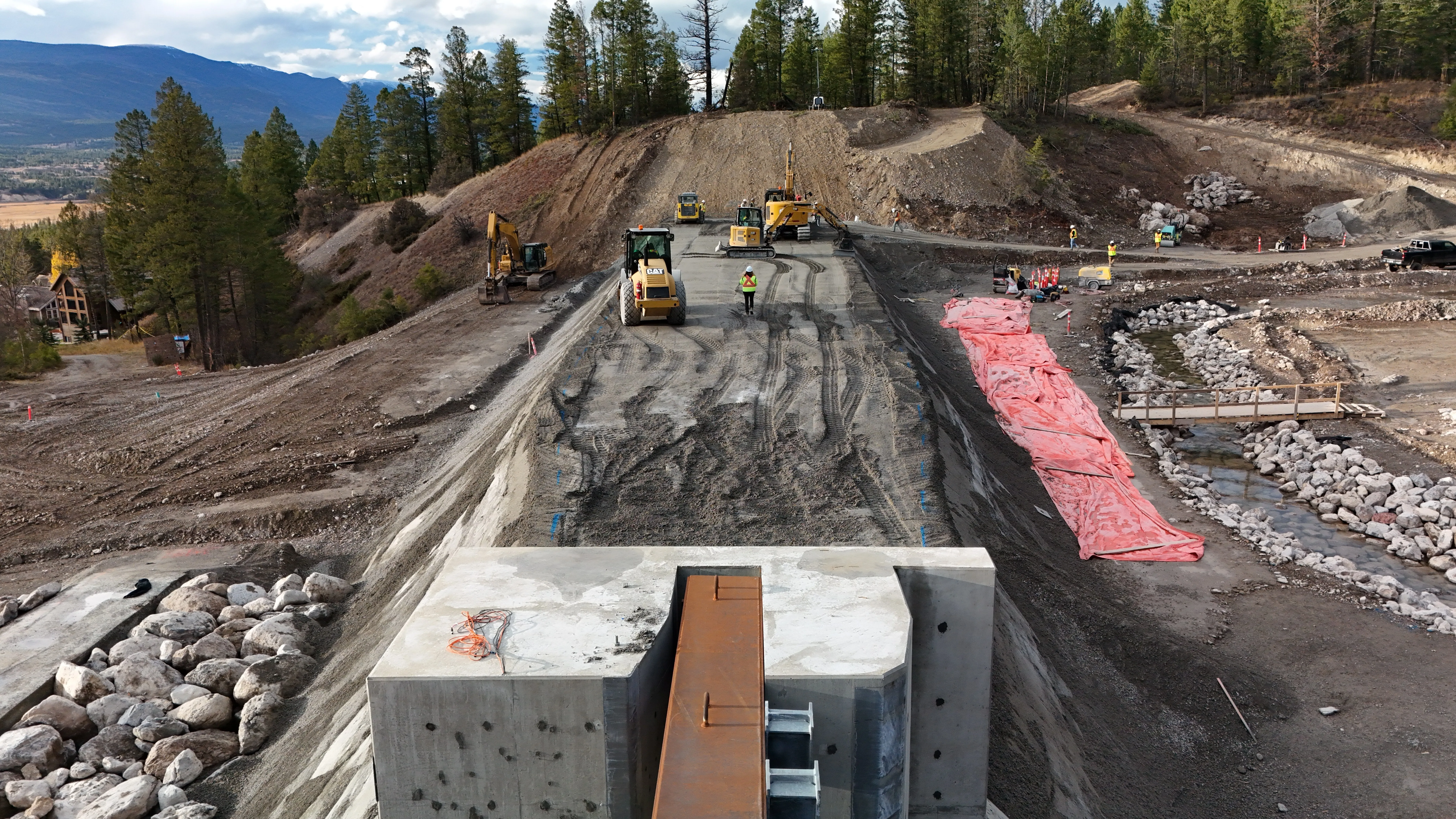 Completed avalanche berm protecting the valley corridor from above